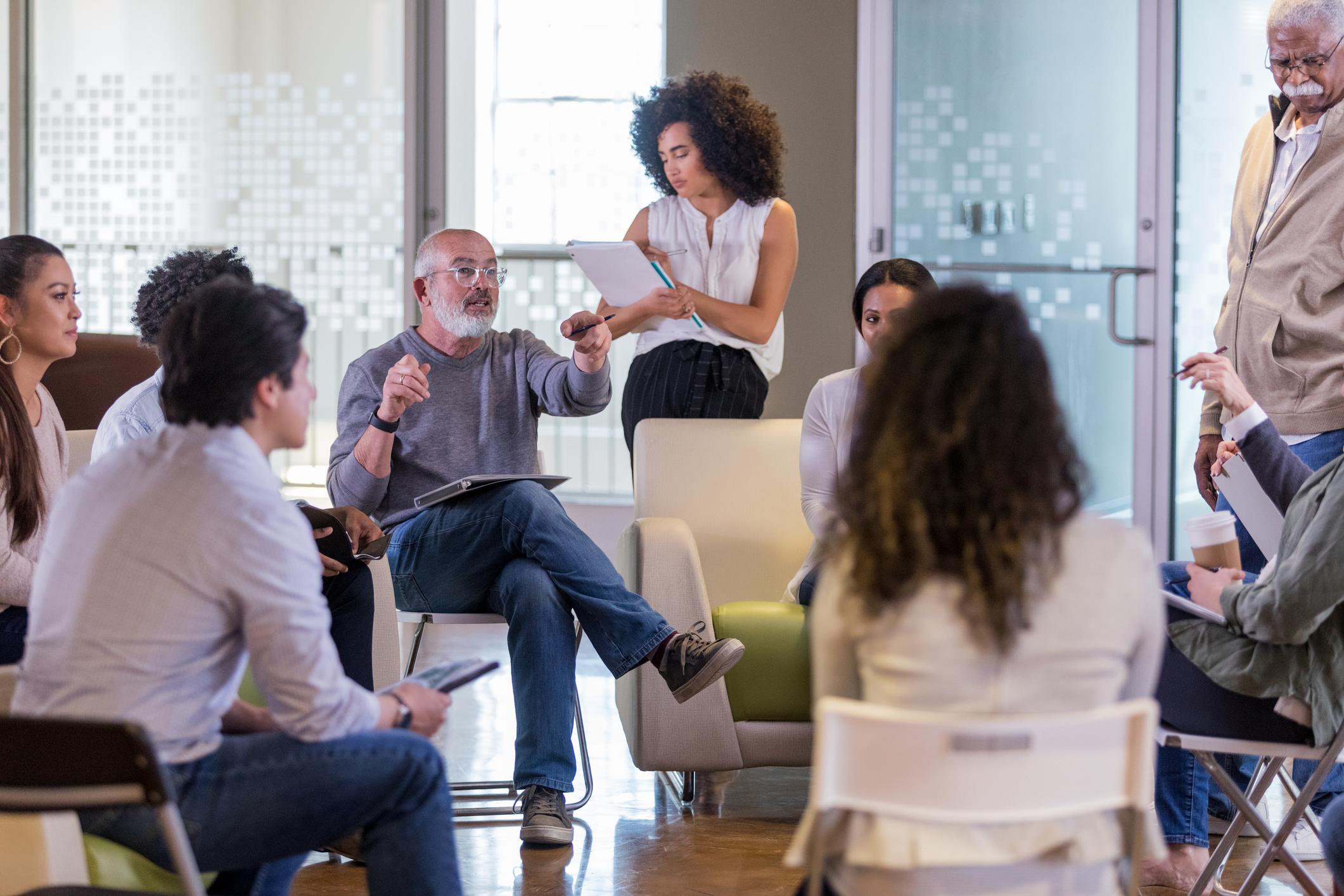 woman talking in group meeting